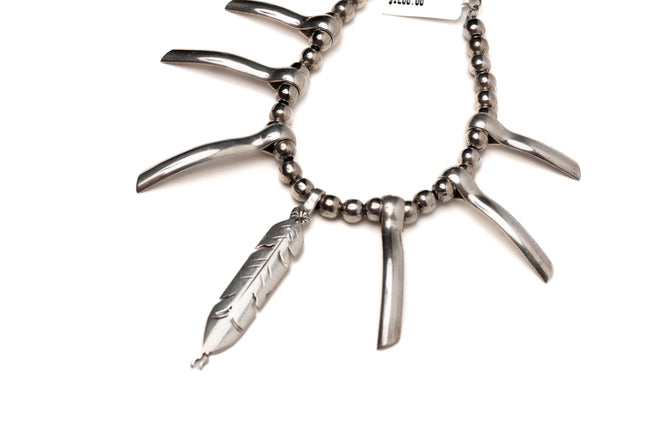 Tribal Inspired Necklace With a Feather Pendant
