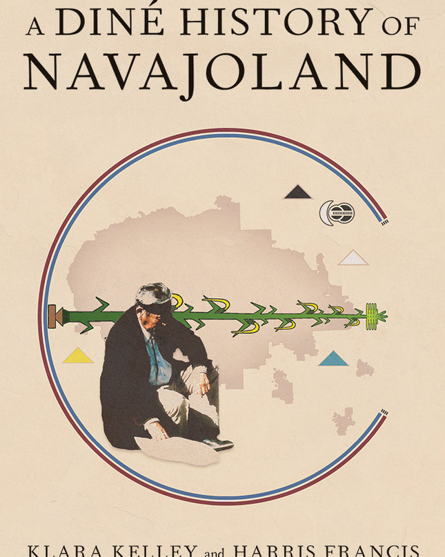 A Navajo Medicine man wearing a black headband is sitting with a map of the current borderlines of the Navjo Nation behind him. Around the map of the navajo nation are the four sacred mountains