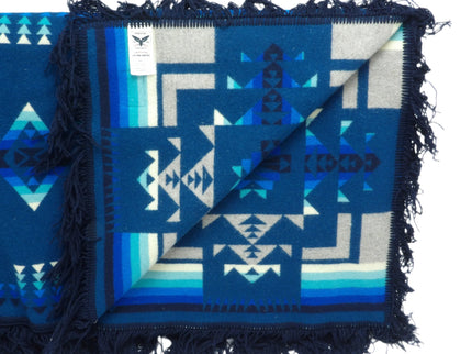 Pendleton Chief Joseph Blanket in Aegean featuring a traditional Native American-inspired geometric pattern with arrow motifs, folded neatly to show intricate design and soft wool texture, Inside View