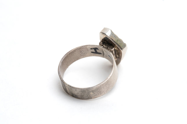 Inside view of Authentic Navajo Kingman turquoise ring on a white background