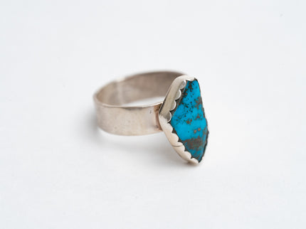 Authentic Navajo Kingman turquoise ring on a white background