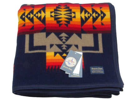 Pendleton Chief Joseph Blanket in Indigo, featuring a traditional Native American-inspired geometric pattern with arrow motifs, folded neatly to show intricate design and soft wool texture. front View 
