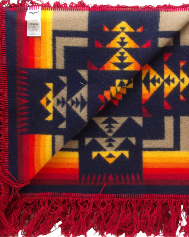 Pendleton Chief Joseph Shawl in indigo, featuring a traditional Native American-inspired geometric pattern with arrow motifs, folded neatly to show intricate design and soft wool texture. Inside view