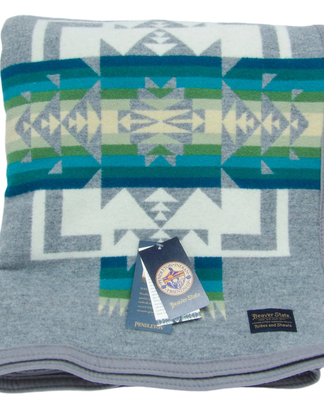 Pendleton Chief Joseph Blanket in Grey featuring a traditional Native American-inspired geometric pattern with arrow motifs, folded neatly to show intricate design and soft wool texture. front View 