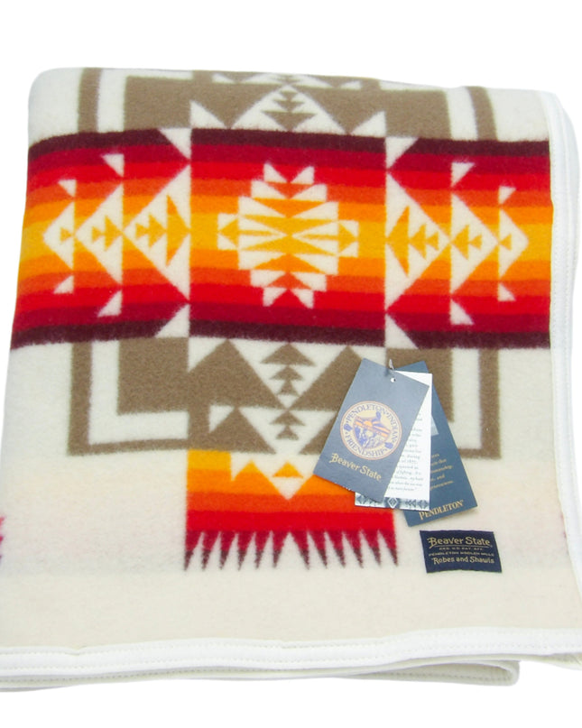 Pendleton Chief Joseph Blanket in Ivory featuring a traditional Native American-inspired geometric pattern with arrow motifs, folded neatly to show intricate design and soft wool texture. front View 