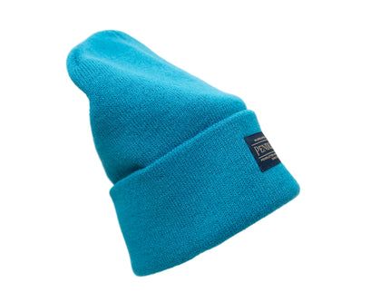 Pendleton teal knitted beanie with a tag on brim back on a white background