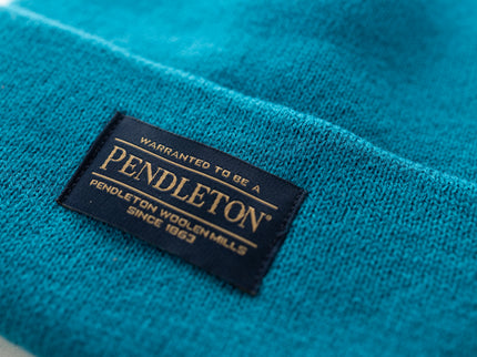 Close-up of Pendleton tag on teal beanie