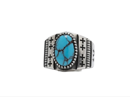 Navajo silver ring with one Egyptian turquoise gemstone on a white background
