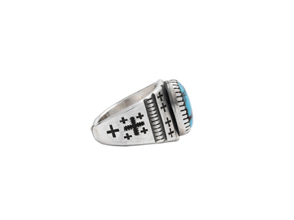 side profile of a Navajo silver ring with cross designs on a light gray background