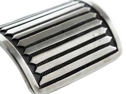 Close up of straight line stamp work on a Navajo silver bracelet cuff
