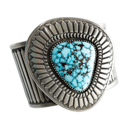 Navajo Silver bracelet with a Kingman turquoise gemstone on a white