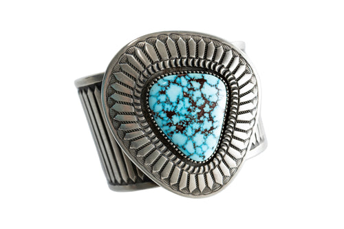 Navajo Silver bracelet with a Kingman turquoise gemstone on a white