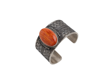 Native American bracelet with a spinner oyster gemstone on a white background