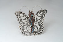 Load image into Gallery viewer, Front side of bracelet showcasing a large silver butterfly with antennas and three turquoise stones.
