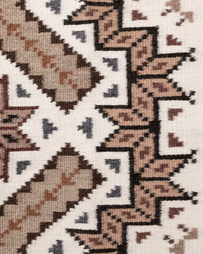 Side close-up of a navajo patterned rug with geometric design