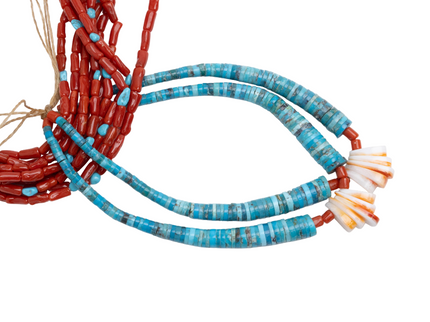 Close-up of Navajo coral jacloo beaded necklace on a white background