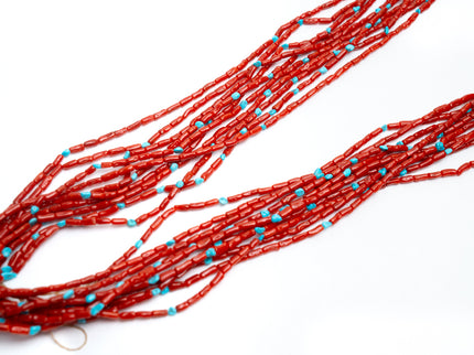 Red and turquoise jackla necklace on a white background