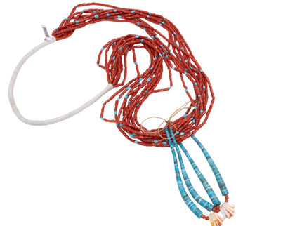Navajo Coral Jacloo necklace with a white cord on a white background