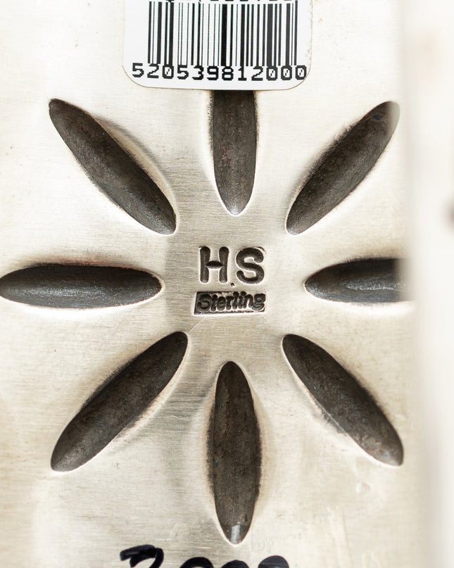 Herman Smith "HS" Hallmark and the words "sterling" stamped into he is silver cuff