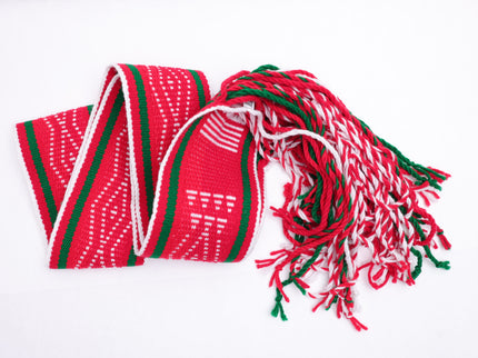 Red and white traditional sash with two green lines folded in a v shape line on a white background