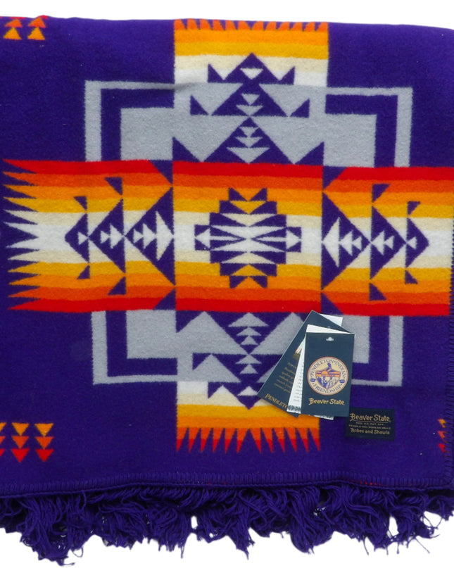 Pendleton Chief Joseph Blanket in purple featuring a traditional Native American-inspired geometric pattern with arrow motifs, folded neatly to show intricate design and soft wool texture front view
