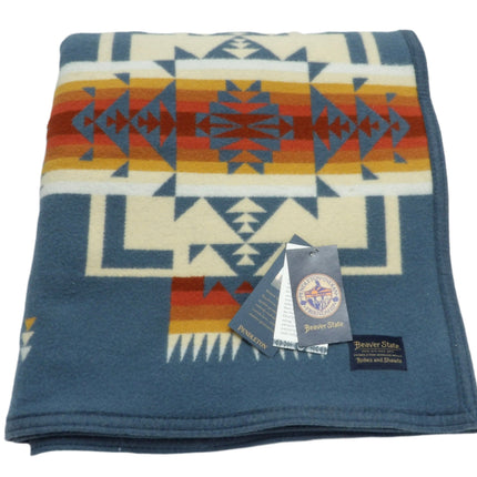 Pendleton Chief Joseph Blanket in Shale featuring a traditional Native American-inspired geometric pattern with arrow motifs, folded neatly to show intricate design and soft wool texture. front View 