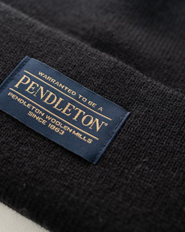 Close up of the Pendleton tag on a black classic beanie
