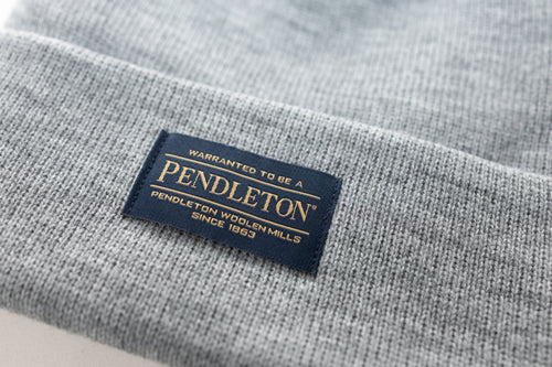 Close up of the Pendleton tag on a grey classic beanie