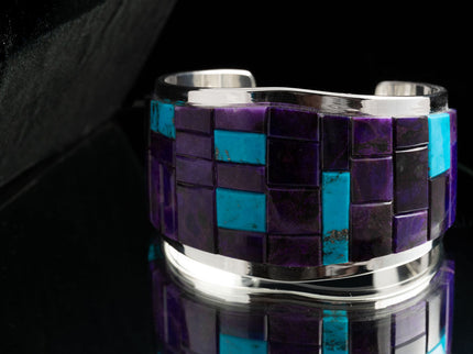 A multicolored inlay bracelet with a mix of purple and blue turquoise