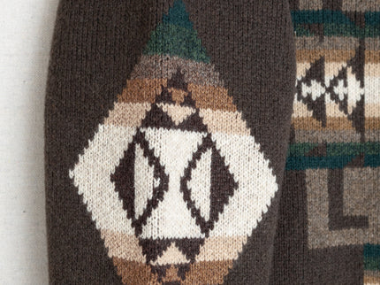 Closeup of Chief Joseph pattern on a brown pullover sweater sleeve