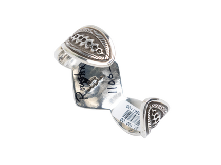Back since of silver bracelet with deep black lines on a white background