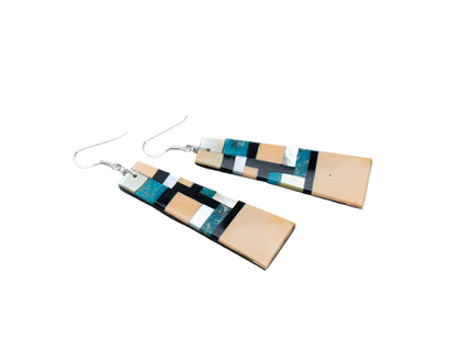 Pair of Zuni Native American inlay earrings on a white background