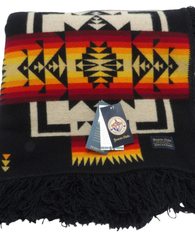 Pendleton Chief Joseph Blanket in Black featuring a traditional Native American-inspired geometric pattern with arrow motifs, folded neatly to show intricate design and soft wool texture. front View 
