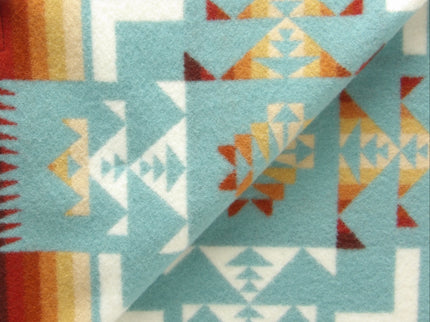 Pendleton Chief Joseph shawl in aqua, featuring a traditional Native American-inspired geometric pattern with arrow motifs, folded neatly to show intricate design and soft wool texture, Inside View