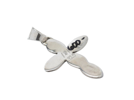 Back side if silver cross pendant showing price written in sharpie