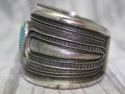A bold sand-cast cuff featuring intricate textures and patterns, Side Profile, 