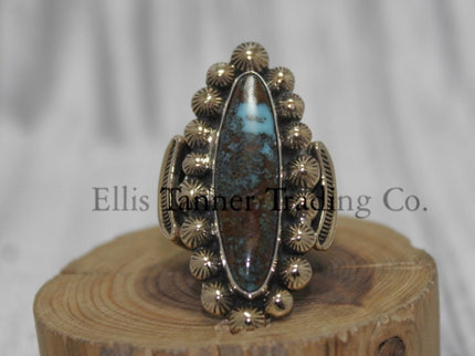 Tommy Jackson 14k overlay with Bisbee turquoise on wooden display 