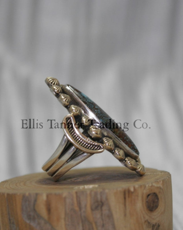 Ring by Tommy Jackson 14k overlay with Bisbee turquoise on wooden display 