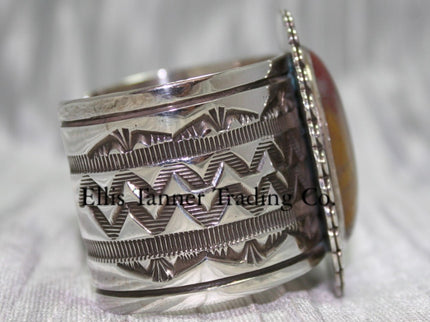 Large silver stamped cuff, side view with hand stamped designs, 