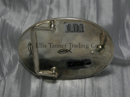 Oval shaped buckle, back side displayed on top of a shiny silver sheet 