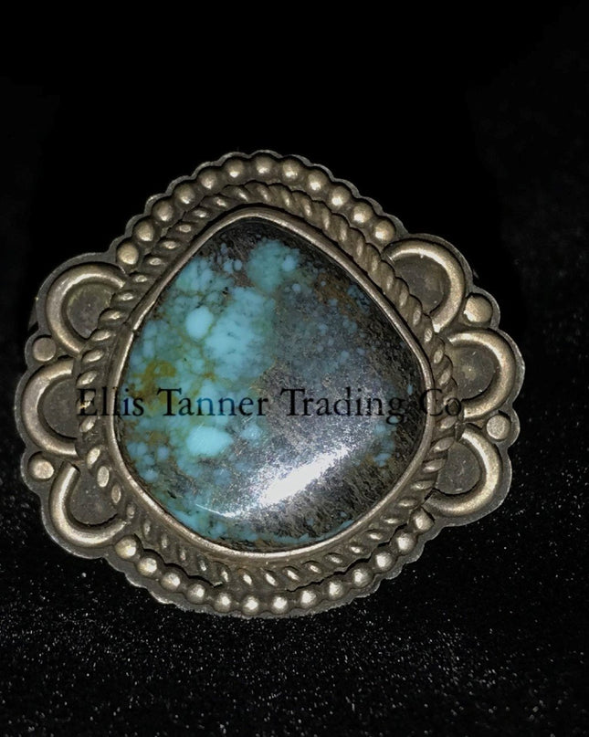 Tommy Jackson Ring with a Silver Twist Bezel, In center a round Bisbee Turquoise, Front View 